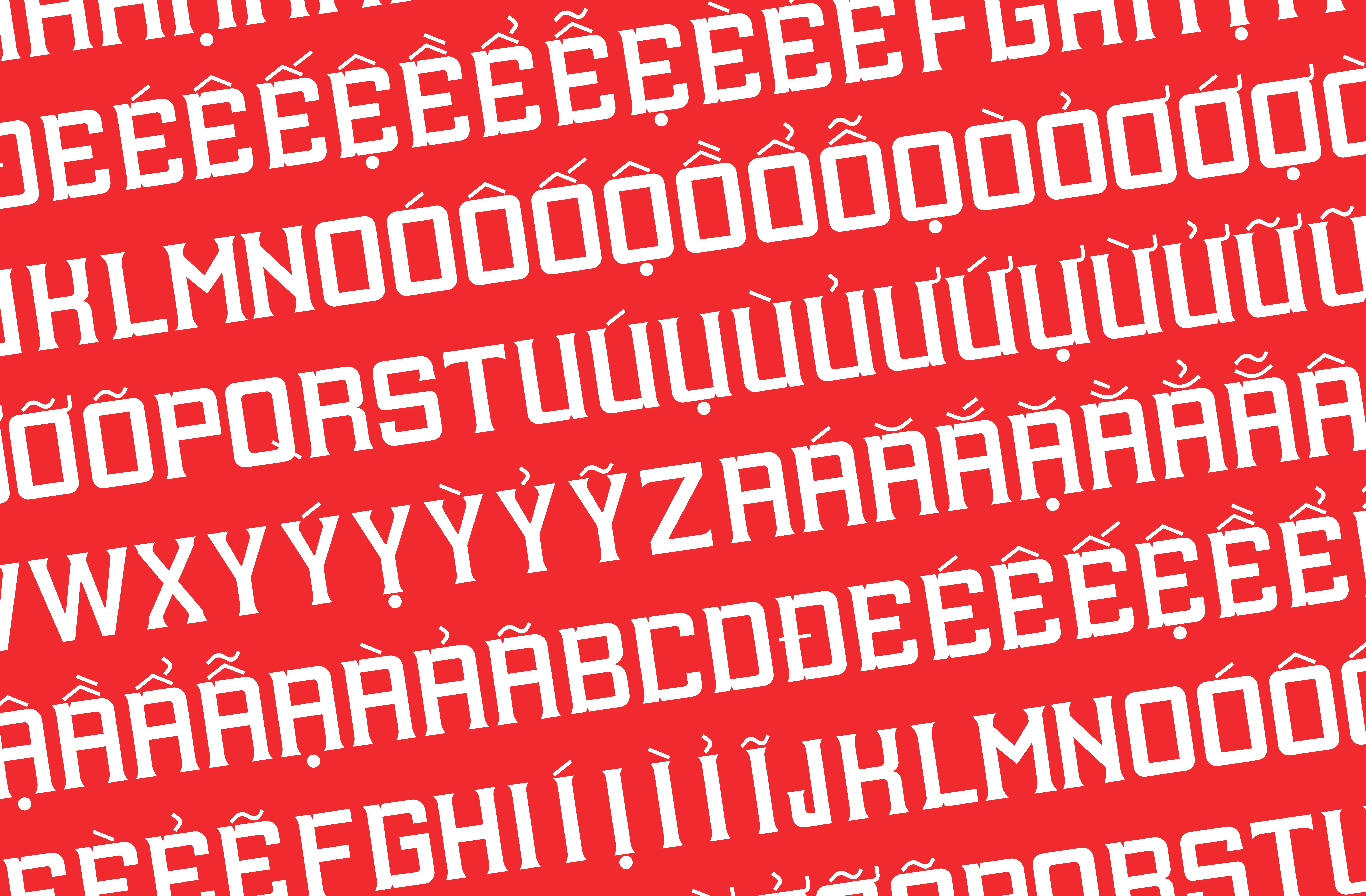 Alphabet repeating in bold type with Vietnamese diacritics, white text on red background